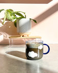 Blue colored glass cup - clouds pattern
